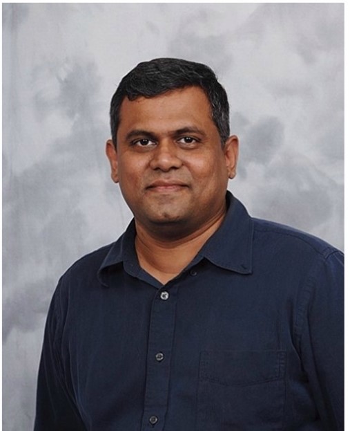 A person in a blue shirt

Description automatically generated with medium confidence