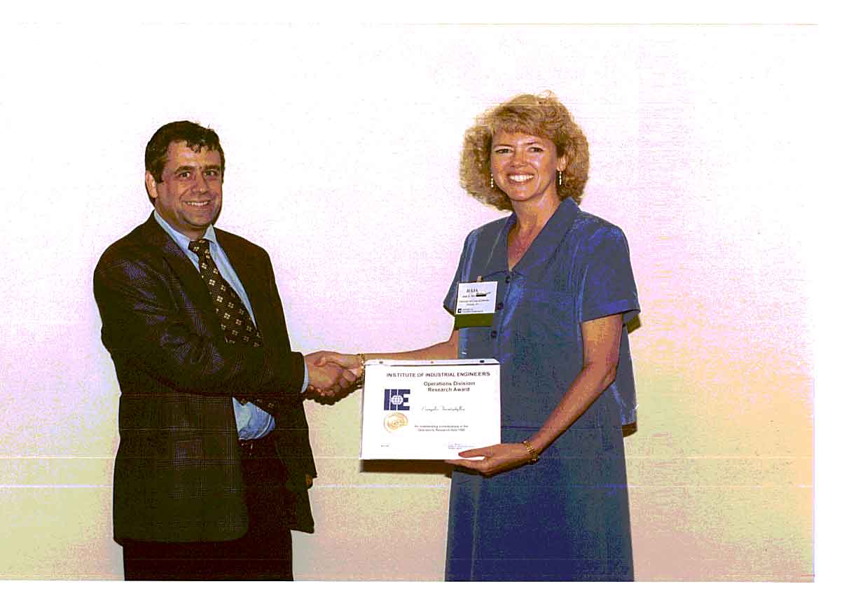 Reception of the IIE Research Award. 
              Drs. Triantaphyllou and Pet-Armacost. Phoenix, AZ, May 1999
